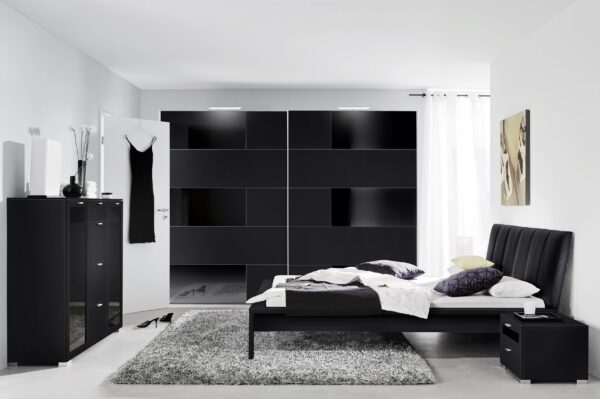 This image shows a black melamine with black glass sliding wardrobe in our Shuffle 3 pattern.