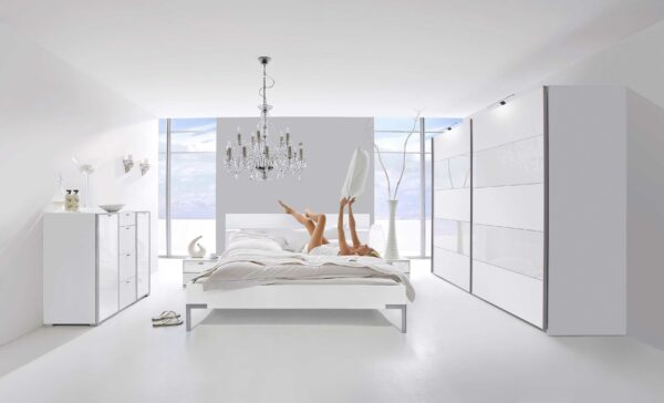 Inline free-standing sliding wardrobe in white melamine and pure white glass panels.